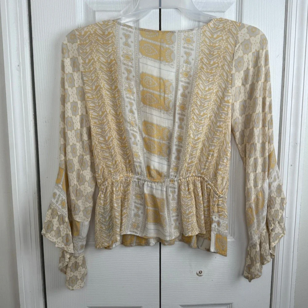 Free People Smocked Peplum‎ Blouse S Yellow Boho Ruffle Sleeve Wrap Top